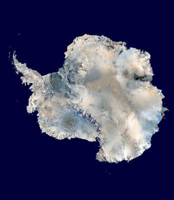 A NASA satellite composite image showing Antarctica centered on the South Pole, with the continent covered in ice, snow, and glaciers, and sea ice encompassing major bays and inlets
