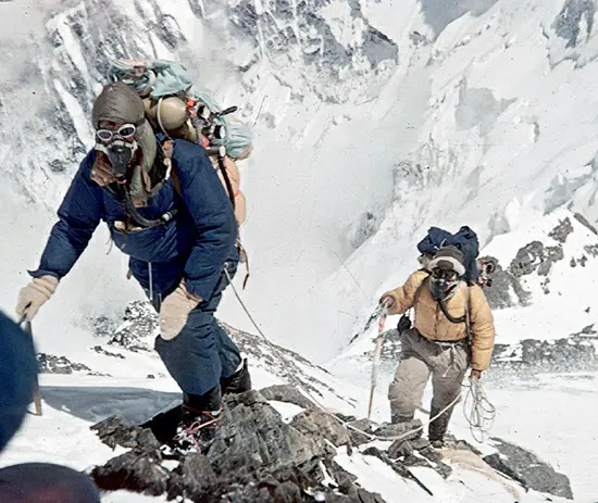 Sir Edmund Hillary (left) and Tenzing Norgay (right) ascending the slopes of Mount Everest in 1953.