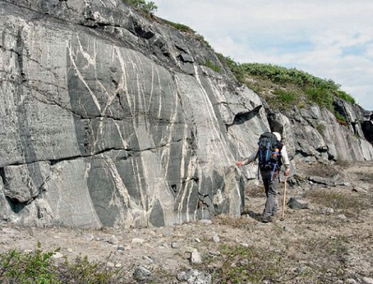 This image shows fractured and metamorphosed remains of ancient continental crust along the eastern shores of Hudson Bay, in the Canadian craton. These rocks originated from the remelting of basaltic rocks that first erupted during the Hadean era.