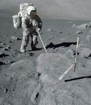 The first scientist on the Moon, geologist Jack Schmitt, examining and collecting soil and rock samples during the Apollo 17 mission in December 1972. Photographed by the mission commander, Gene Cernan.