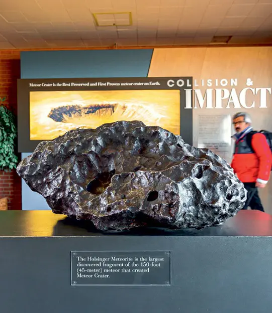The largest known fragment of the small metallic asteroid responsible for creating Meteor Crater, showcased at the crater's visitor center in Winslow, Arizona.