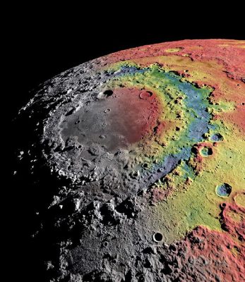 This image of the Orientale Basin on the Moon, spanning 578 miles (930 km), illustrates evidence of intense planetary bombardment occurring 400 to 700 million years after Earth's formation. The color variations indicate areas of lower (blue) and higher (red) gravity within the basin.