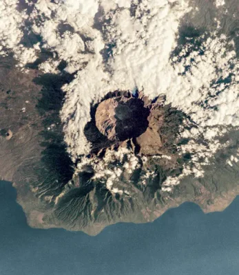 A 2005 photograph of the volcanic island and caldera of Mount Tambora, Indonesia, taken from the International Space Station. In April 1815, Mount Tambora witnessed the most powerful volcanic eruption in recorded history.