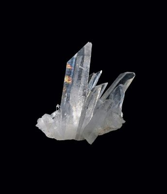 An impressive, hand-sized cluster of quartz crystals from Tibet.
