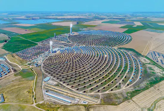 A 2017 photograph of a sizable solar collector power station located in Andalusia, Spain.