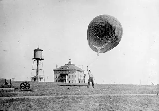 A photograph of the hand-guided release of a typical US Weather Service atmospheric sounding balloon, taken sometime between 1909 and 1920.