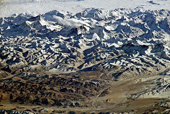 A view of the Himalayas from the Tibetan Plateau, captured by astronauts on the International Space Station in 2004, with Mt. Everest in the center.
