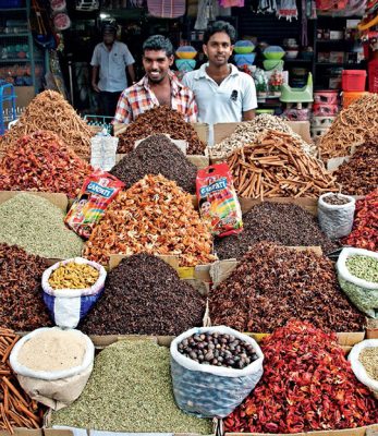 Various common and exotic spices on display at a market in Kerala, India.