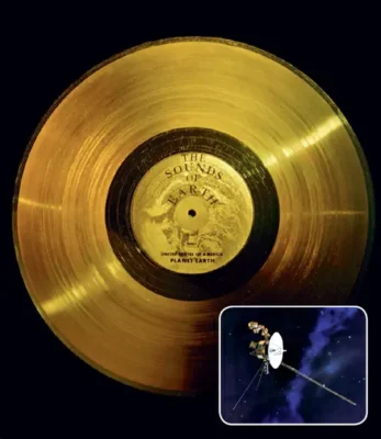 Main image: A 12-inch-diameter (30.5 centimeters) gold-plated copper disc called the Voyager Golden Record. Two of these discs are carrying recorded songs, greetings, and images from Earth on a journey through the galaxy. Inset: An artist's concept of the Voyager spacecraft.