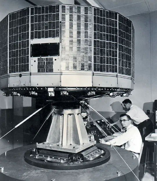 A 1960 photo of engineers testing the Television Infrared Observation Satellite (TIROS), the world's first successful weather satellite, at RCA in Princeton, New Jersey.